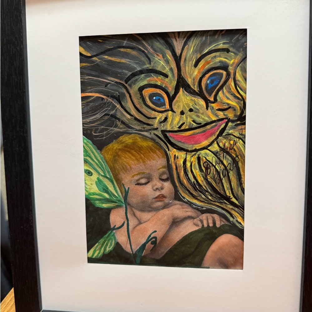 Vibrant Green and Yellow Mask Painting with a baby fairy.